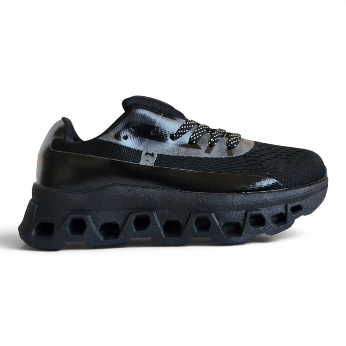 BRIKLYN black athletic running sneaker with breathable knit upper and architectural geometric midsole