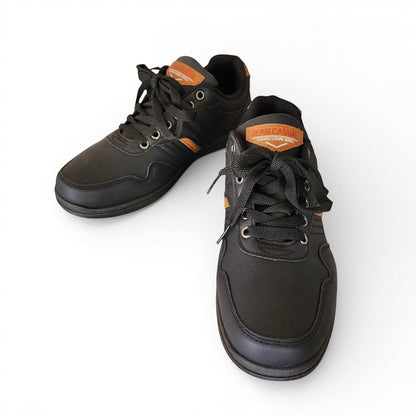 BRIKLYN black faux leather casual sneakers with tan accents and lace-up closure.