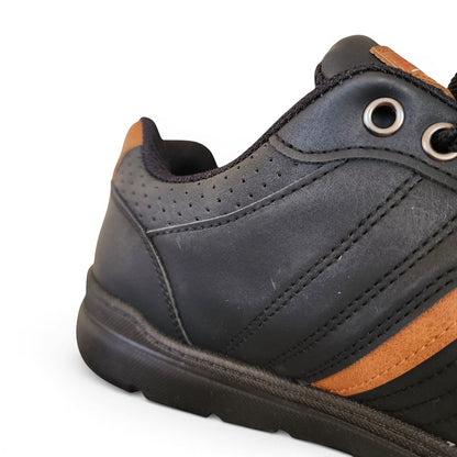 BRIKLYN black faux leather casual sneakers with tan accents, lace-up closure, and perforated detailing.