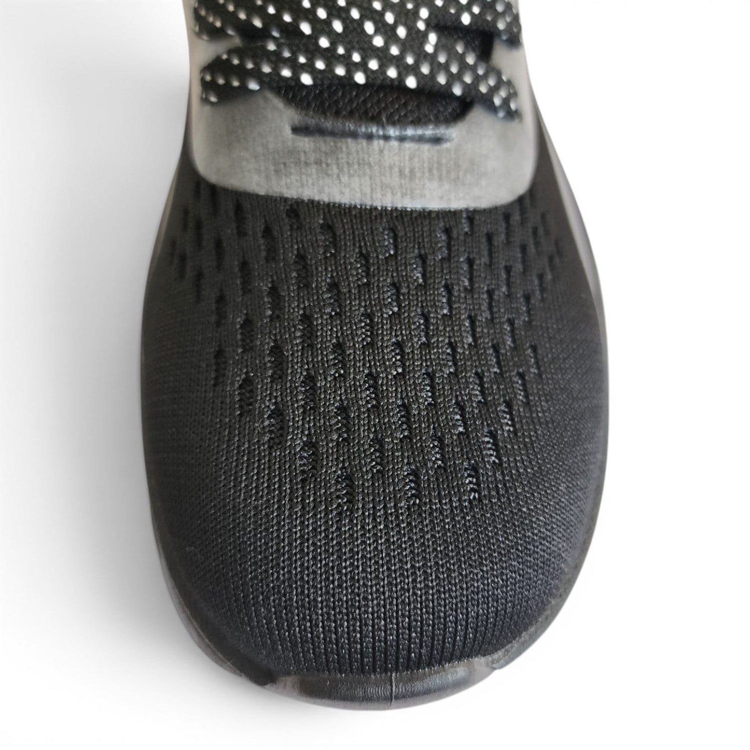 BRIKLYN performance running sneaker with a black breathable knit upper and patterned laces on a white background