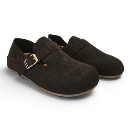 BRIKLYN dark brown suede slip-on clogs with an adjustable gold buckle strap and a flat rubber sole.