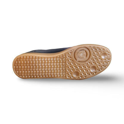 BRIKLYN men's retro sneakers with black upper and gum rubber sole. Low-top court-style silhouette with white accents.