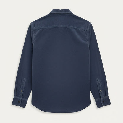 BRIKLYN navy blue corduroy long sleeve button-up shirt with two chest pockets and button cuffs.