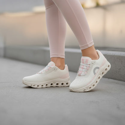 BRIKLYN cream and blush pink On Running Cloudflow performance sneakers with mesh upper and hollow-pod sole on a runner