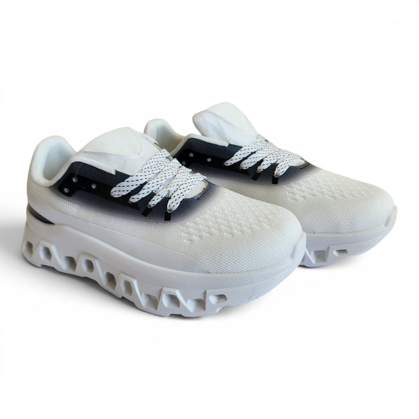 BRIKLYN white athletic running sneakers with breathable knit upper, geometric midsole, and black gradient accents.