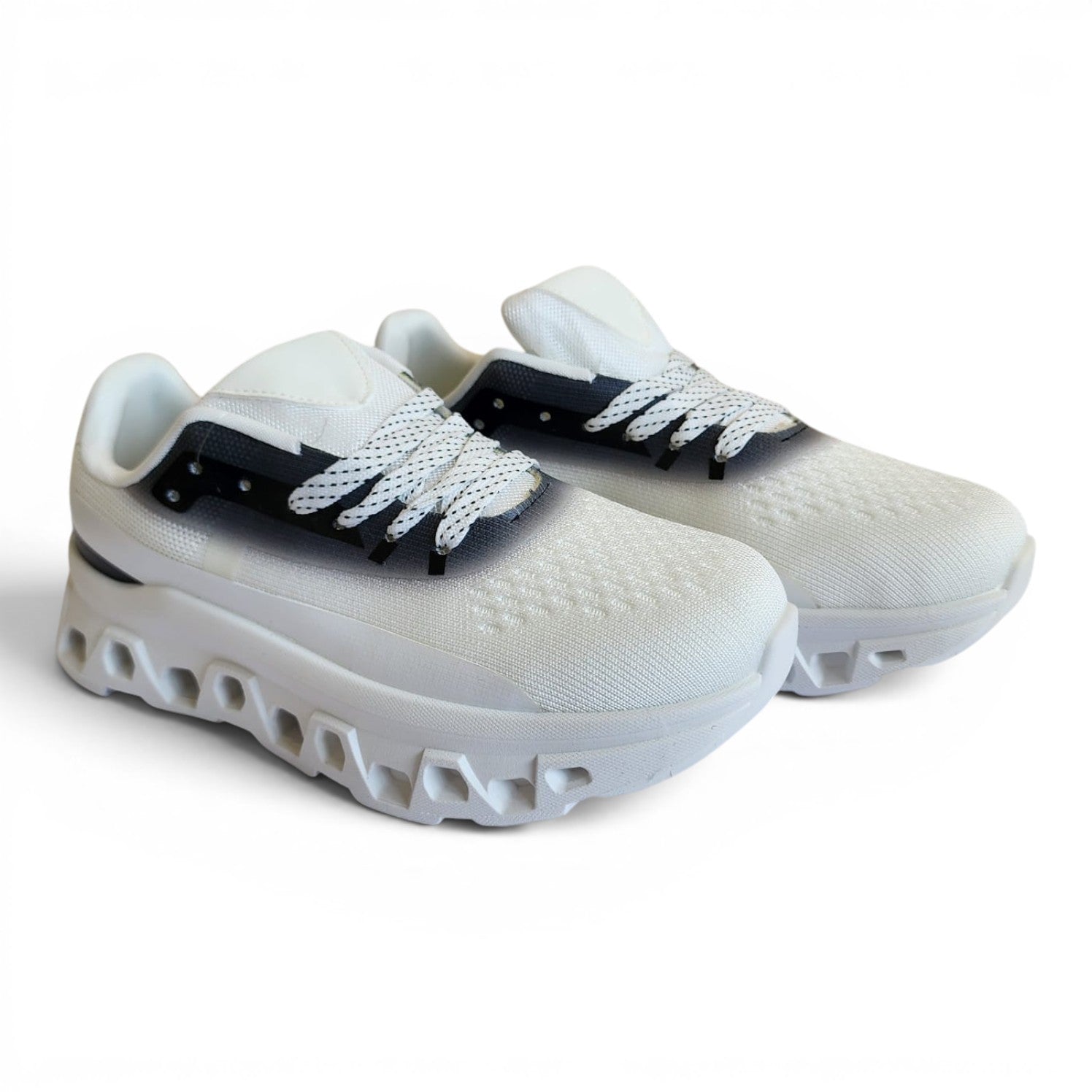 BRIKLYN white athletic running sneakers with breathable knit upper, geometric midsole, and black gradient accents.