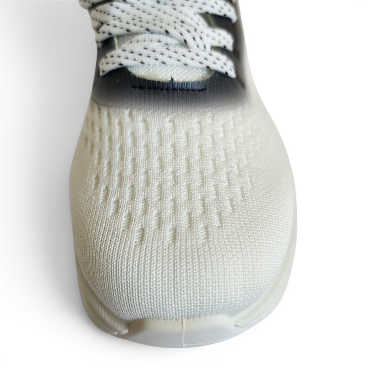 BRIKLYN performance athletic running sneaker featuring a white breathable knit upper and black gradient lace detail.